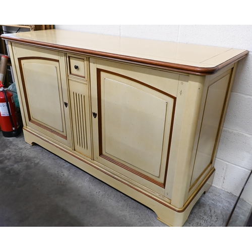 238 - A French cream painted sideboard by Le Creuset, the two panelled cupboard doors separated by fluted ... 