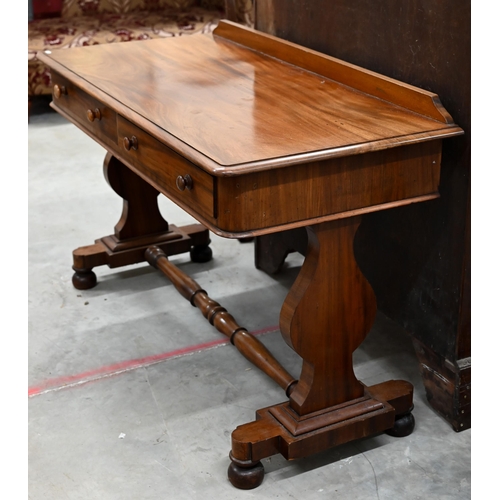 243 - A Victorian mahogany two drawer console or side table on shaped supports united by a turned stretche... 