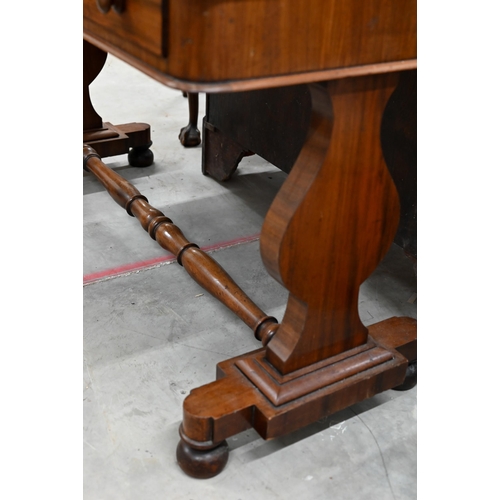 243 - A Victorian mahogany two drawer console or side table on shaped supports united by a turned stretche... 