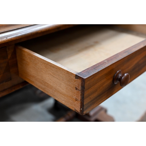 243 - A Victorian mahogany two drawer console or side table on shaped supports united by a turned stretche... 