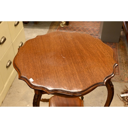 244 - # A reproduction mahogany two-tier scalloped table, 60 cm diam x 70 cm high to/w mahogany three-divi... 