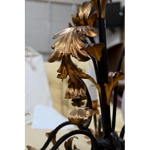 245 - A six-branch foliate chandelier/electrolier, black wrought iron with gilt leaves, 50 cm high