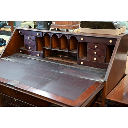 249 - A George III mahogany fall front bureau with four long graduating drawers and shaped bracket feet (a... 