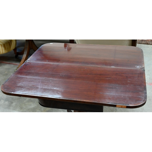 250 - # A 19th century mahogany crossbanded folding tea table on reeded turned column and quadraform base,... 