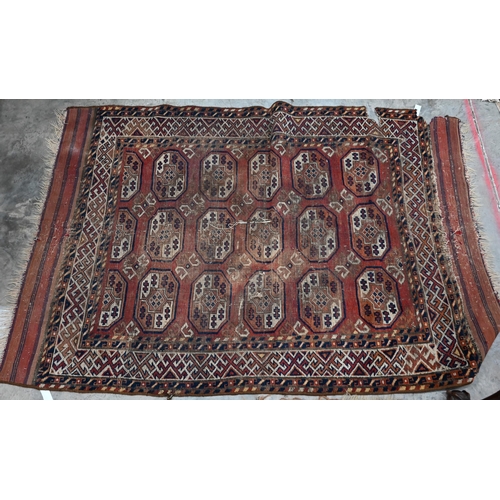 251 - Four old worn Persian rugs - Turkoman with repeat gul design on red ground, 165 x 115 cm; Balouch 15... 