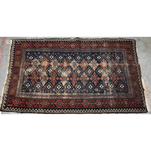 251 - Four old worn Persian rugs - Turkoman with repeat gul design on red ground, 165 x 115 cm; Balouch 15... 