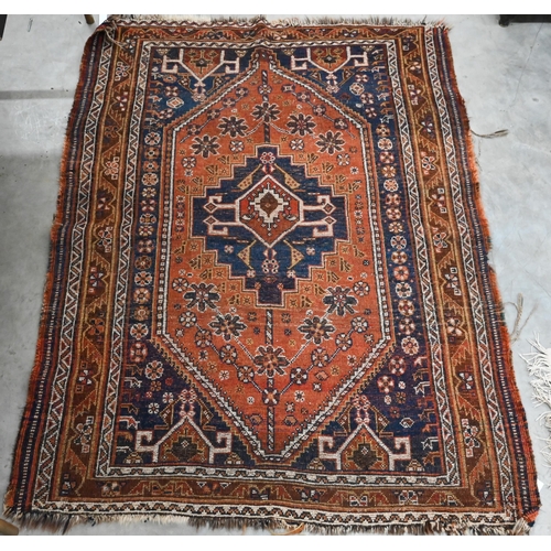 251 - Four old worn Persian rugs - Turkoman with repeat gul design on red ground, 165 x 115 cm; Balouch 15... 