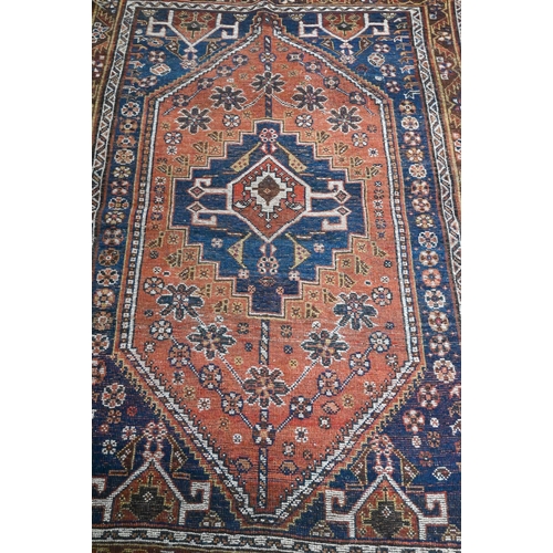 251 - Four old worn Persian rugs - Turkoman with repeat gul design on red ground, 165 x 115 cm; Balouch 15... 