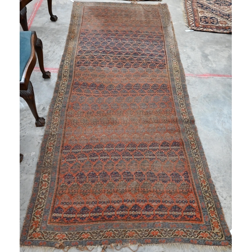 251 - Four old worn Persian rugs - Turkoman with repeat gul design on red ground, 165 x 115 cm; Balouch 15... 