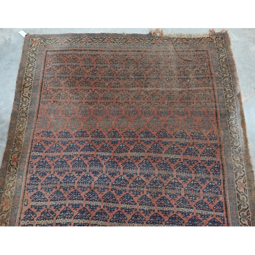 251 - Four old worn Persian rugs - Turkoman with repeat gul design on red ground, 165 x 115 cm; Balouch 15... 