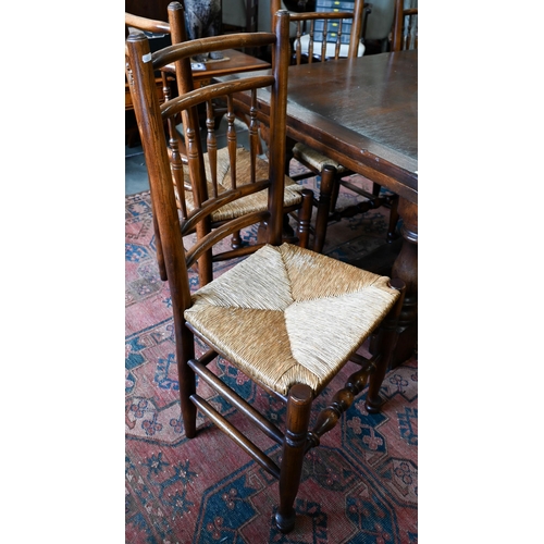 255 - An oak draw-leaf refectory dining table with cleated planked top on turned supports with stretchers,... 