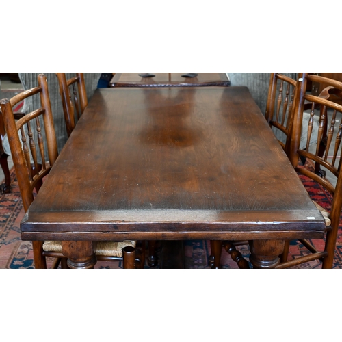 255 - An oak draw-leaf refectory dining table with cleated planked top on turned supports with stretchers,... 