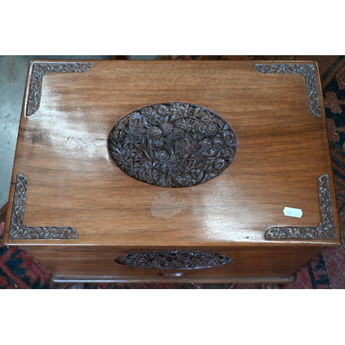 257 - An Indian hardwood sewing/work box with carved floral decoration, 44 x 28 x 40 cm high