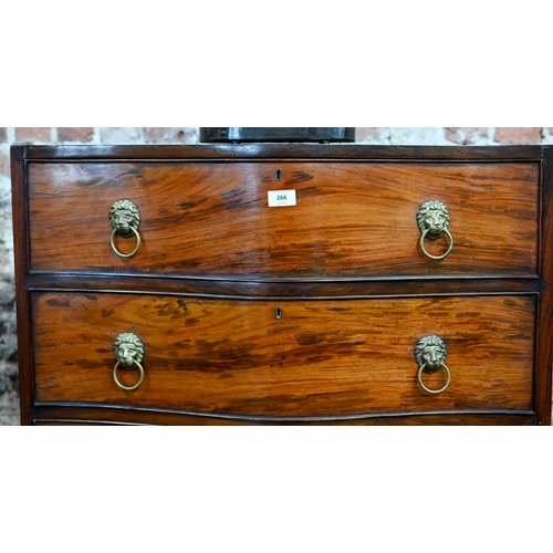 266 - An antique mahogany serpentine front six drawer mahogany chest on chest, with brass lion mask handle... 