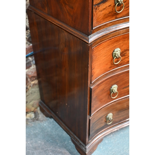 266 - An antique mahogany serpentine front six drawer mahogany chest on chest, with brass lion mask handle... 