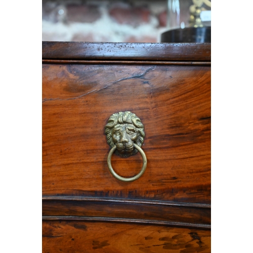 266 - An antique mahogany serpentine front six drawer mahogany chest on chest, with brass lion mask handle... 