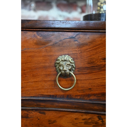 266 - An antique mahogany serpentine front six drawer mahogany chest on chest, with brass lion mask handle... 