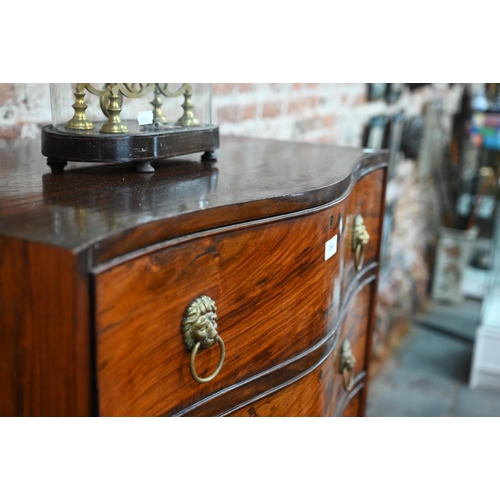 266 - An antique mahogany serpentine front six drawer mahogany chest on chest, with brass lion mask handle... 