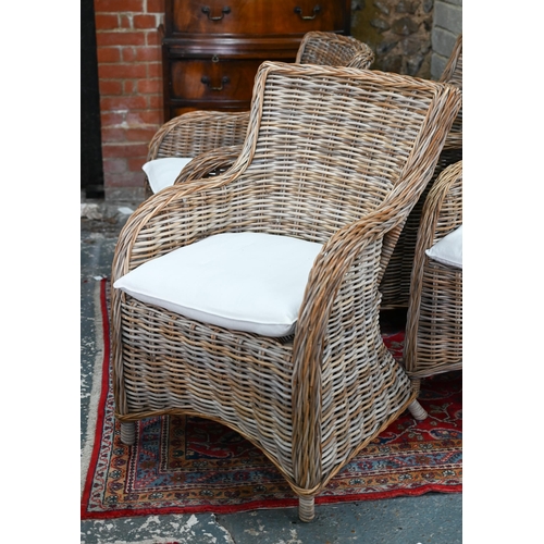 267 - A set of four rattan orangery armchairs, with loose cushions seat pads (4)