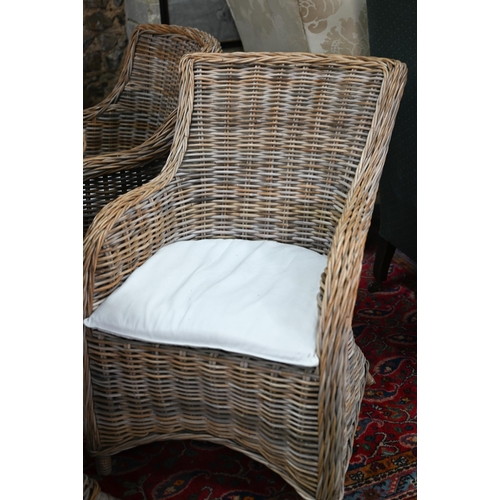 267 - A set of four rattan orangery armchairs, with loose cushions seat pads (4)