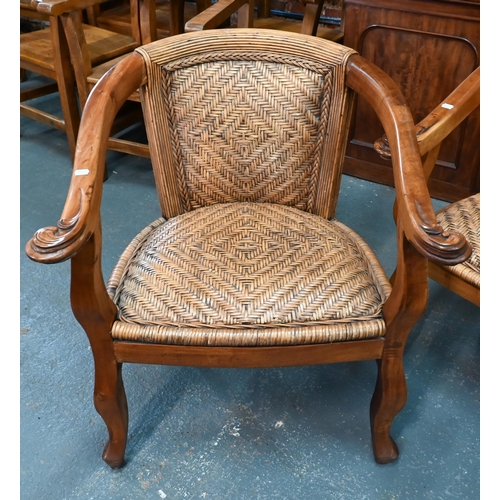 268 - A pair of South African 'Weatherlys' hardwood and rattan elbow chairs, a/f (2)