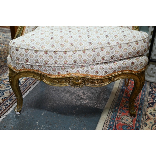 280 - An old Continental gilt frame salon armchair with patterned fabric upholstery