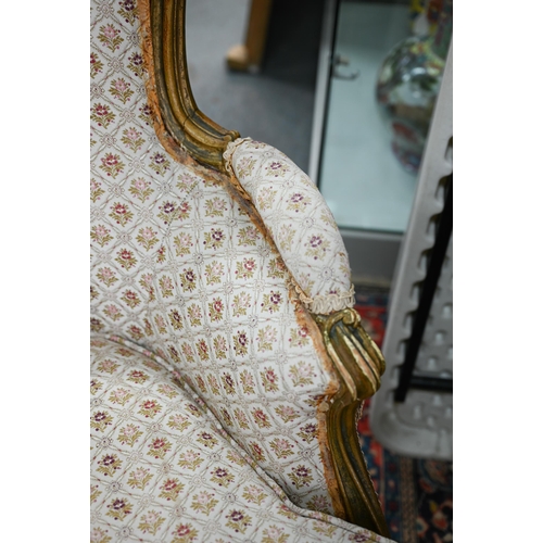 280 - An old Continental gilt frame salon armchair with patterned fabric upholstery