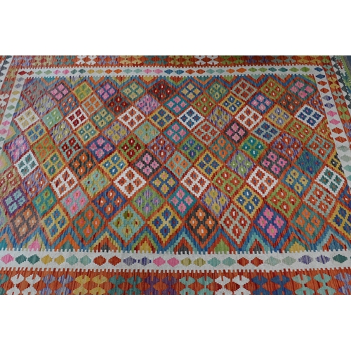 284 - A contemporary Anatolian Turkish Kelim, overall multi-coloured geometric design, 245 cm x 178 cm