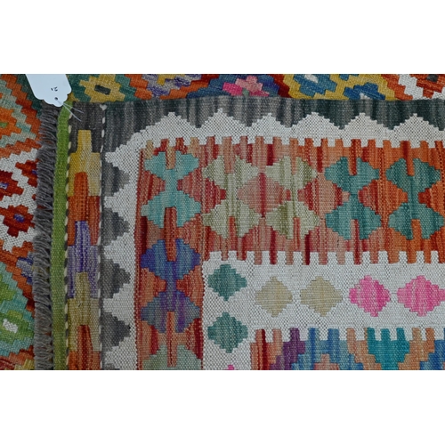 284 - A contemporary Anatolian Turkish Kelim, overall multi-coloured geometric design, 245 cm x 178 cm