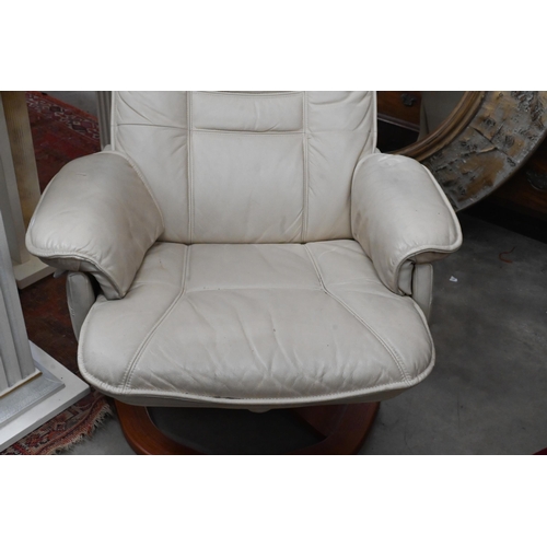 291 - A Stressless-style cream leatherette swivel armchair