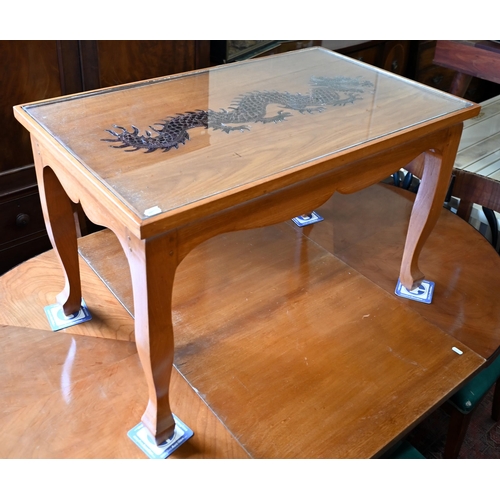 296 - A Chinese hardwood coffee table, the top with copper filigree inset dragon under glass, on shaped su... 