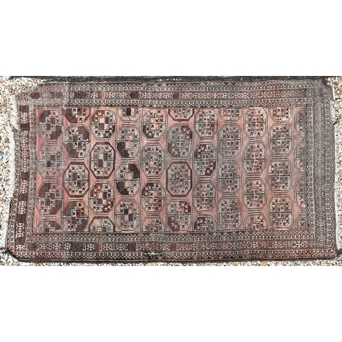 382 - An old Balouchi brown ground rug with repeating octagonal gul design, 212 x 131 cm to/w Afghan rug w... 