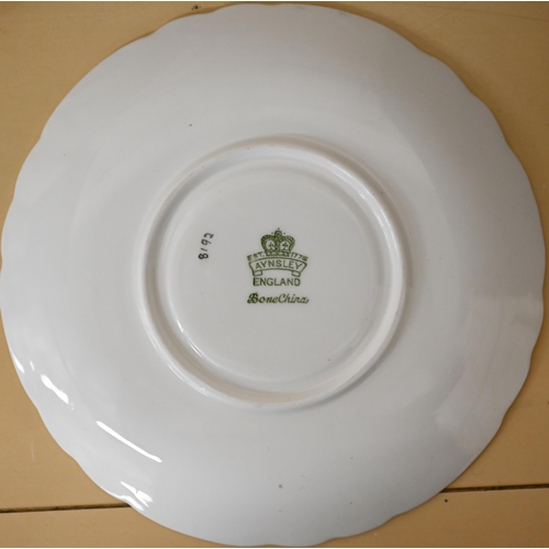 402 - An Aynsley tea/dinner service with cream, green and gilt borders, 54 pieces (box)