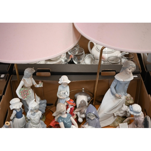 405 - Four Lladro figures - girl reading in a chair, young girl sleeping in a rocking chair, puppy and boy... 