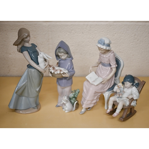 405 - Four Lladro figures - girl reading in a chair, young girl sleeping in a rocking chair, puppy and boy... 