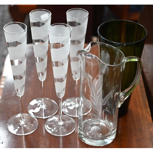 428 - A set of six part-frosted glass champagne flutes to/w seven cut glass decanters and other glassware ... 