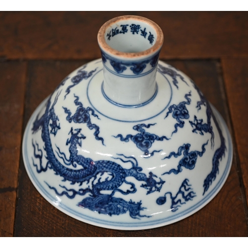 432 - A Chinese blue and white stem-cup, painted with dragons and flaming pearls, 17.5 cm diam, to/w two Y... 