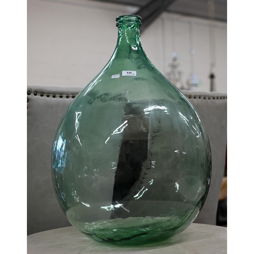 438 - Three green glass carboys, 65 cm high