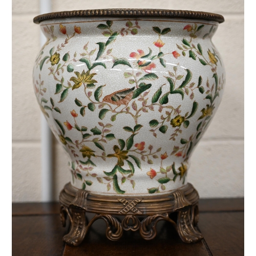 446 - An Asian pottery jardiniere printed with birds, flowers and foliage, with metal rim and foot, 31 cm ... 