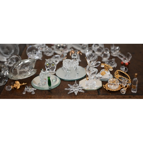 467 - Eleven Mats Jonassen (Malera, Sweden) glass collectors' ornaments to/w a collection of Swarovski gla... 