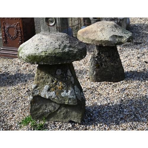 47 - Two antique weathered cut stone low staddle stones, 65 cm and 55 cm high (2)