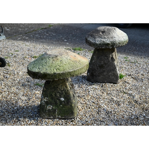 47 - Two antique weathered cut stone low staddle stones, 65 cm and 55 cm high (2)