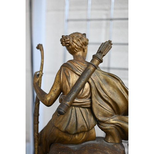 470 - A late 19th century bronzed spelter mantel clock case, surmounted by the figure of a classical huntr... 