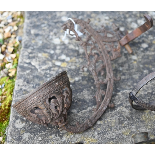 471 - Two iron wall-brackets for oil-lamps and a twin-sconce candle-bracket (3)