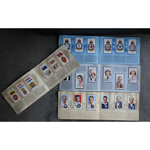 473 - # Four vintage Wills's and Player's cigarette card albums, to/w an album of first day covers and a s... 