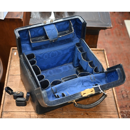 482 - An antique dark blue morocco leather Gladstone bag with watered silk & leather fitted lining (la... 