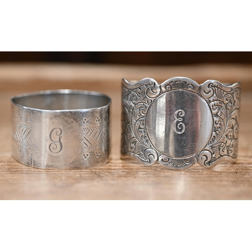 485 - A .925 standard cotton spool in embossed cylindrical case, two silver napkin rings, an engraved hing... 