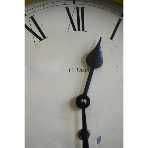 495 - A walnut-cased wall-clock with 29 cm dial and brass bezel