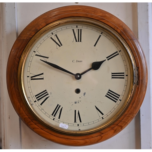 495 - A walnut-cased wall-clock with 29 cm dial and brass bezel