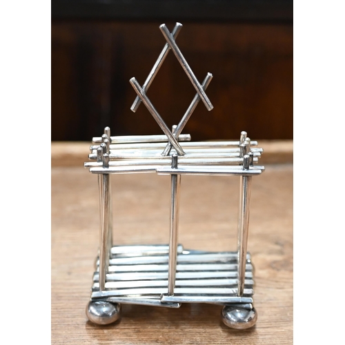 512 - A Mappin & Webb Arts & Crafts ep expanding toast-rack in the manner of Christopher Dresser, ... 